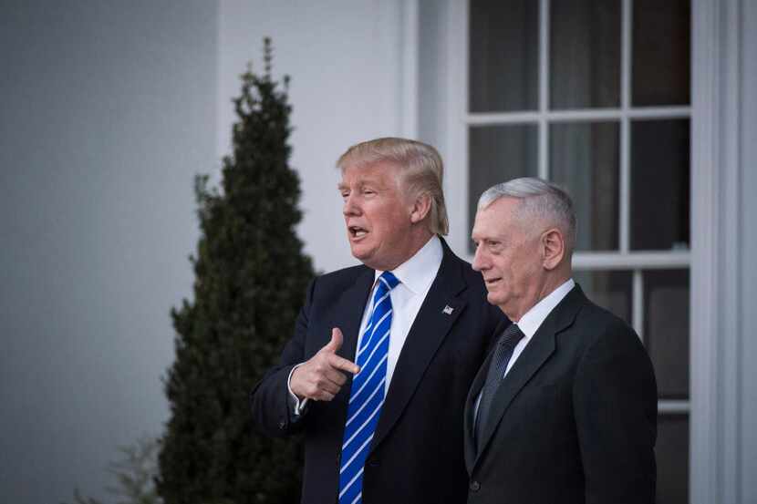 President-elect Donald Trump walks out with retired Marine Corps Gen. James Mattis after a...