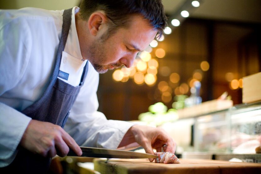 Executive chef and owner Tyson Cole prepares mackerel sashimi at Uchiko on North Lamar in...