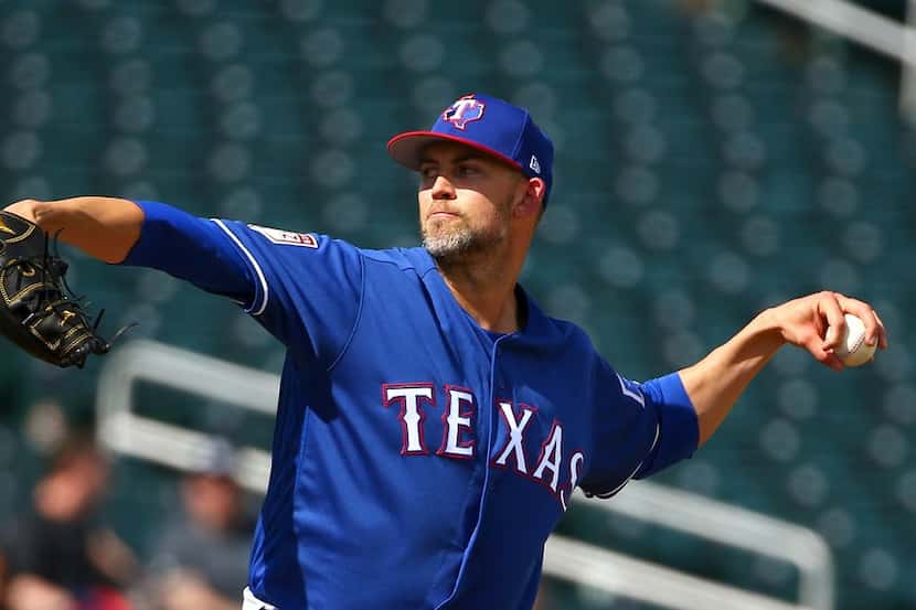 Texas Rangers pitcher Mike Minor throws against the Cleveland Indians during the second...