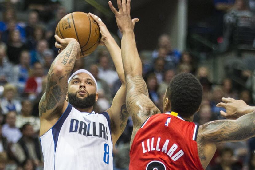 Dallas Mavericks guard Deron Williams (8) shoots over Portland Trail Blazers guard Damian...
