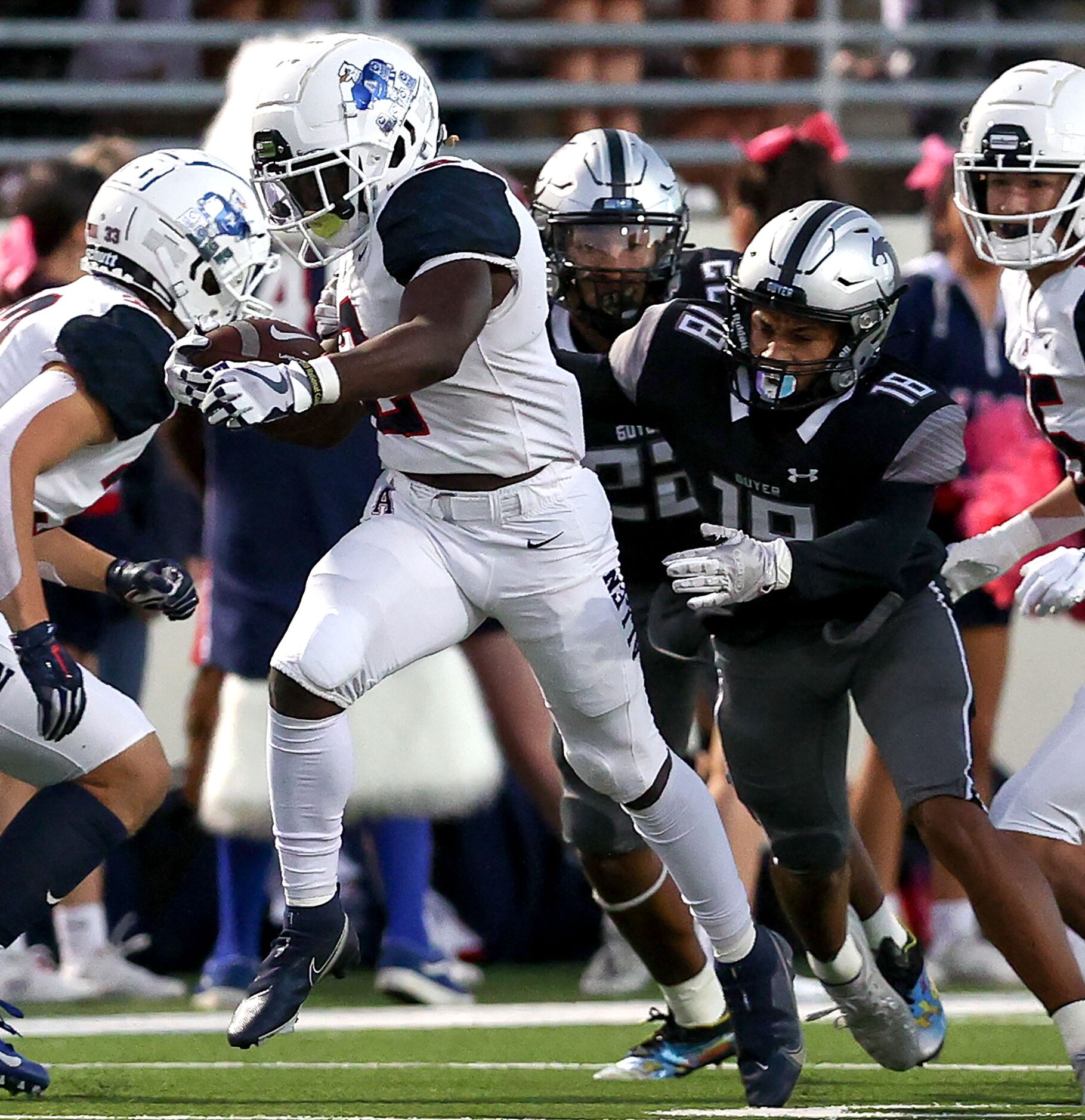 Allen running back Jaylen Jenkins (2) get past Denton Guyer defensive back Eli Bowen (18)...