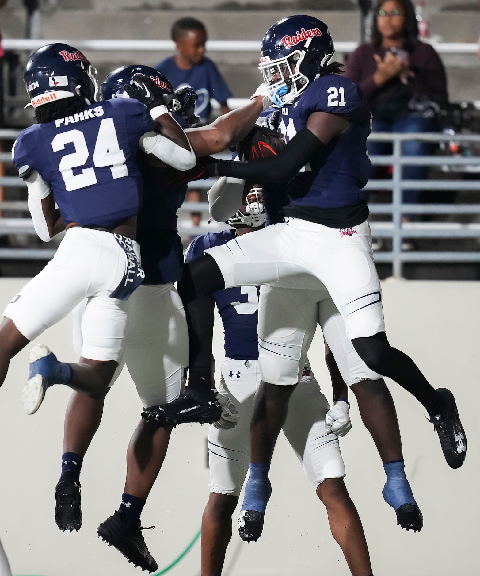 Denton Ryan linebacker Dillon Arkansas (21) celebrates with teammates after returning an...