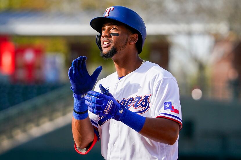 Texas Rangers outfielder Leody Taveras celebrates after reaching on a single during the...