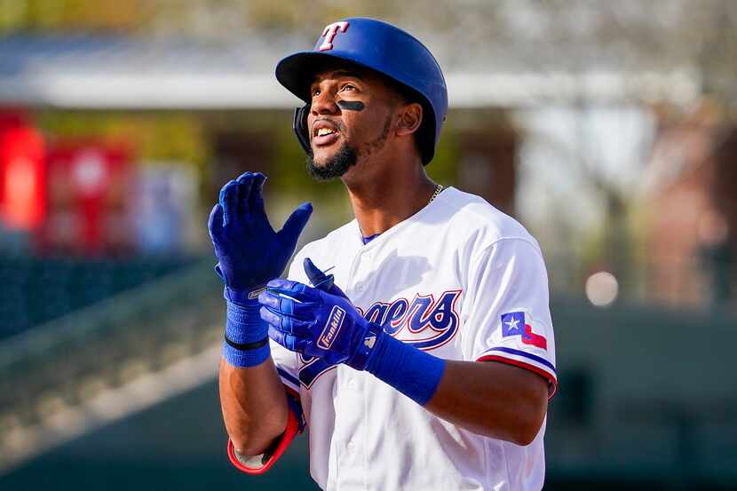 Rangers outfielder Leody Taveras celebrates after reaching base on a single during the...