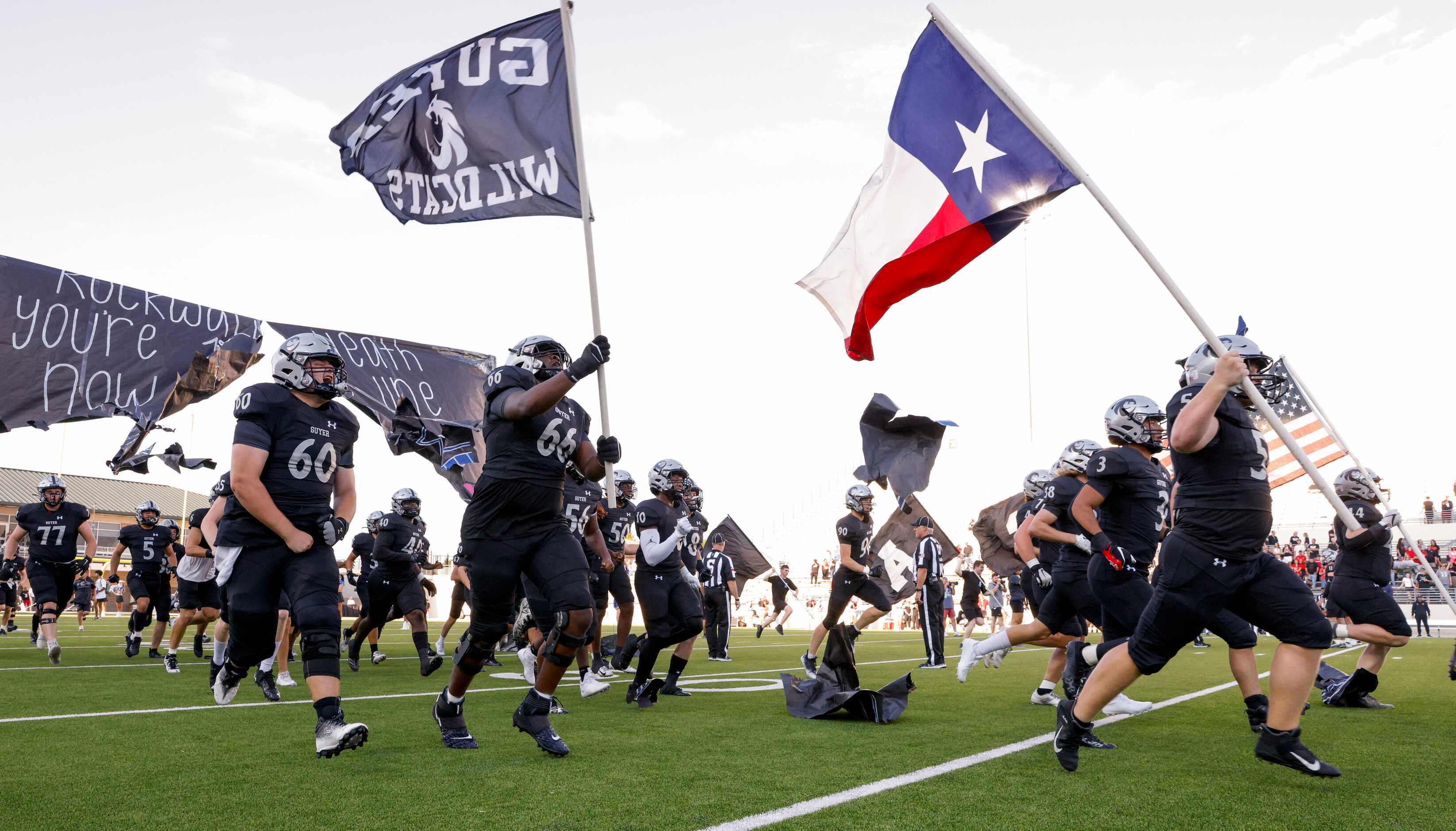 Denton Guyer takes the field before the first game of the season against Rockwall-Heath at...