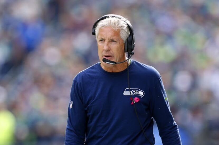 Seattle Seahawks head coach Pete Carroll walks the sideline during his game with the Dallas...