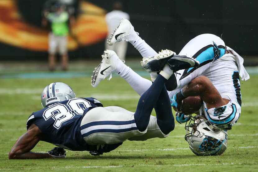 Carolina Panthers wide receiver Jarius Wright (13) tumbles after receiving the ball past...
