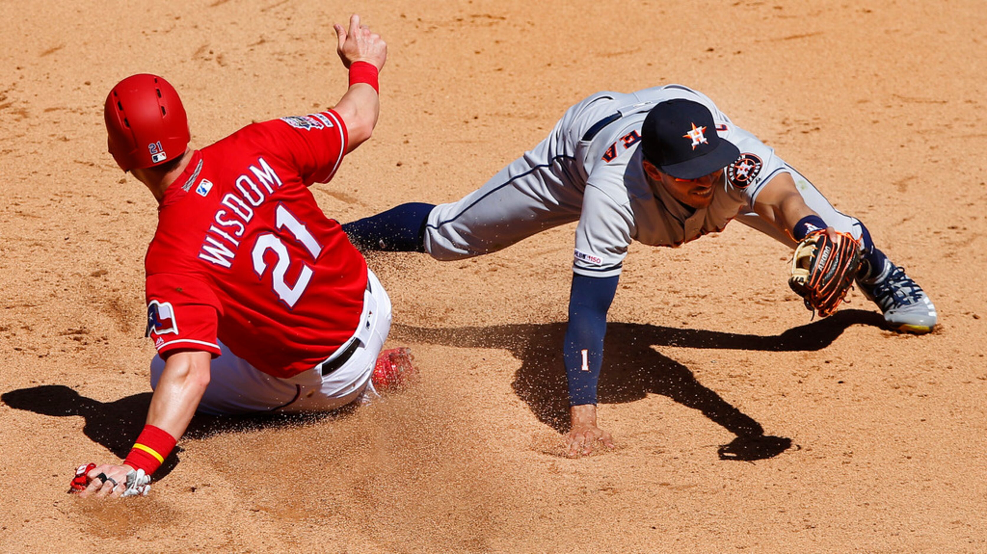 Texas Rangers Patrick Wisdom (21) is out at second on a fielders choice by Houston Astros...