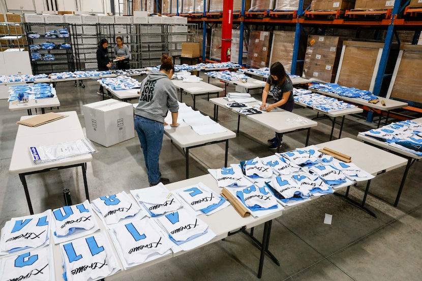 REN Athletics staff prepare a volleyball team order at the company's McKinney headquarters.