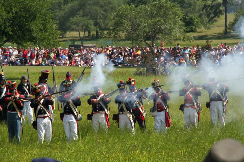 In a reenactment of the Battle of San Jacinto, Mexican troops fire on the Texas rebels....