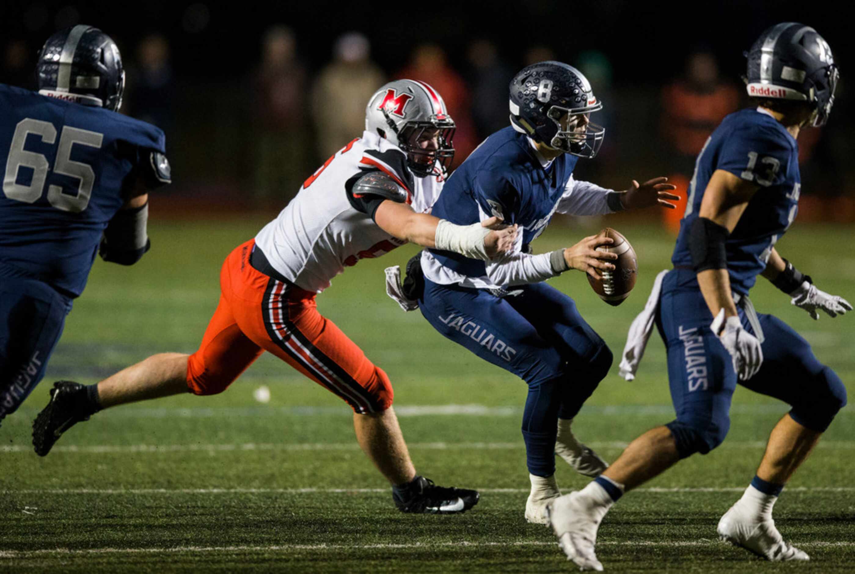 Flower Mound Marcus defensive lineman Max Walstad (56) sacks Flower Mound quarterback Blake...