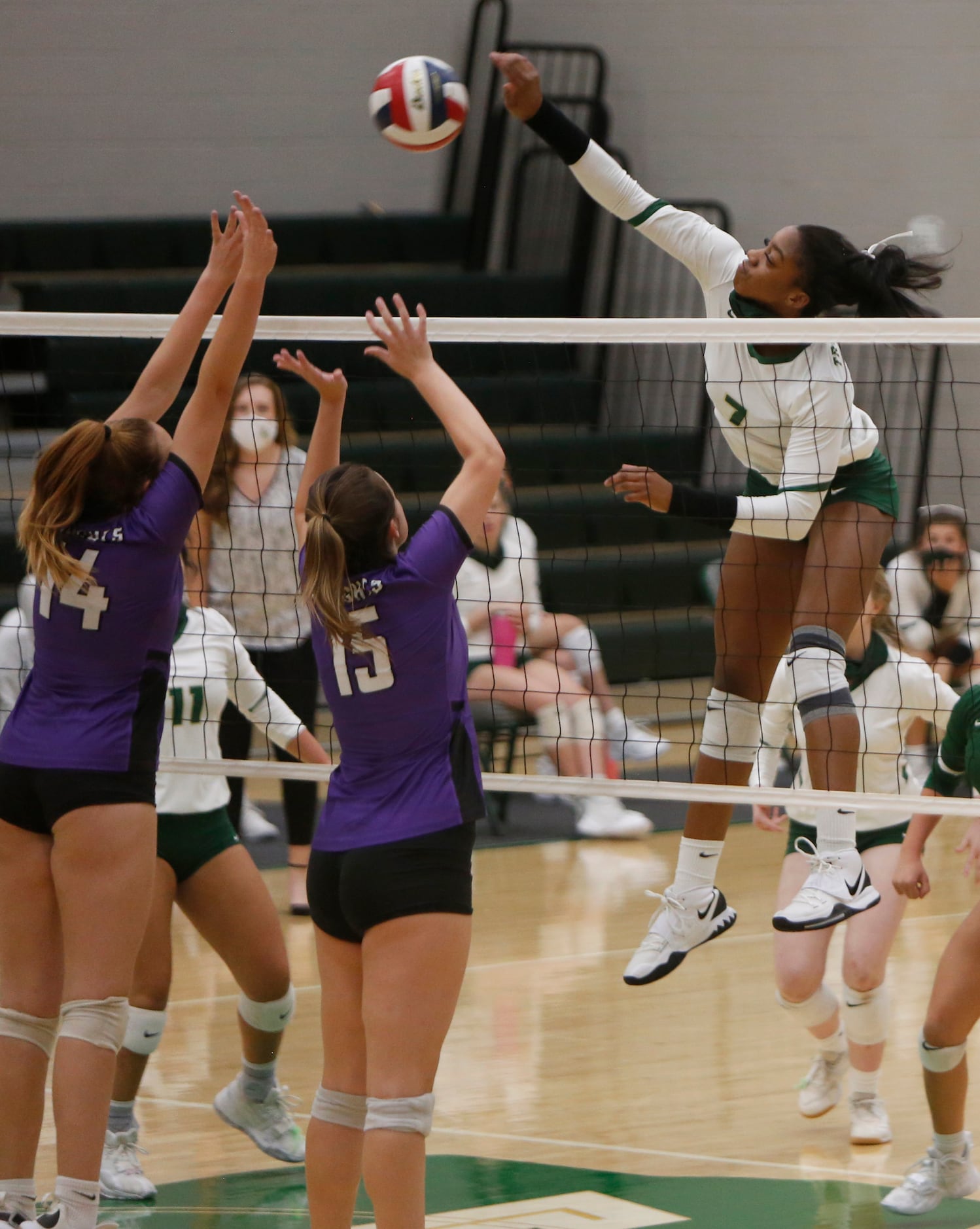 Frisco Lebanon Trail's Tyrah Ariail (7) skies well above the net to fire a shot that scored...