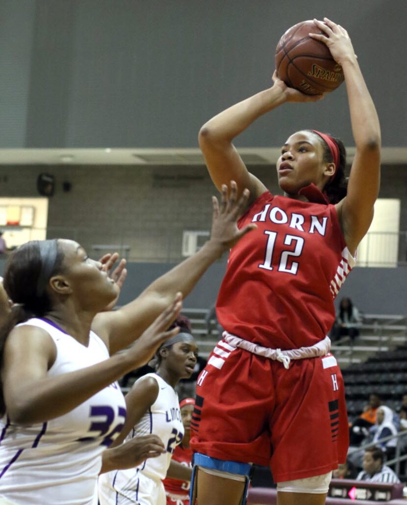 Mesquite Horn guard Jada Underwood (12) gets off a jump shot over the defense of Dallas...