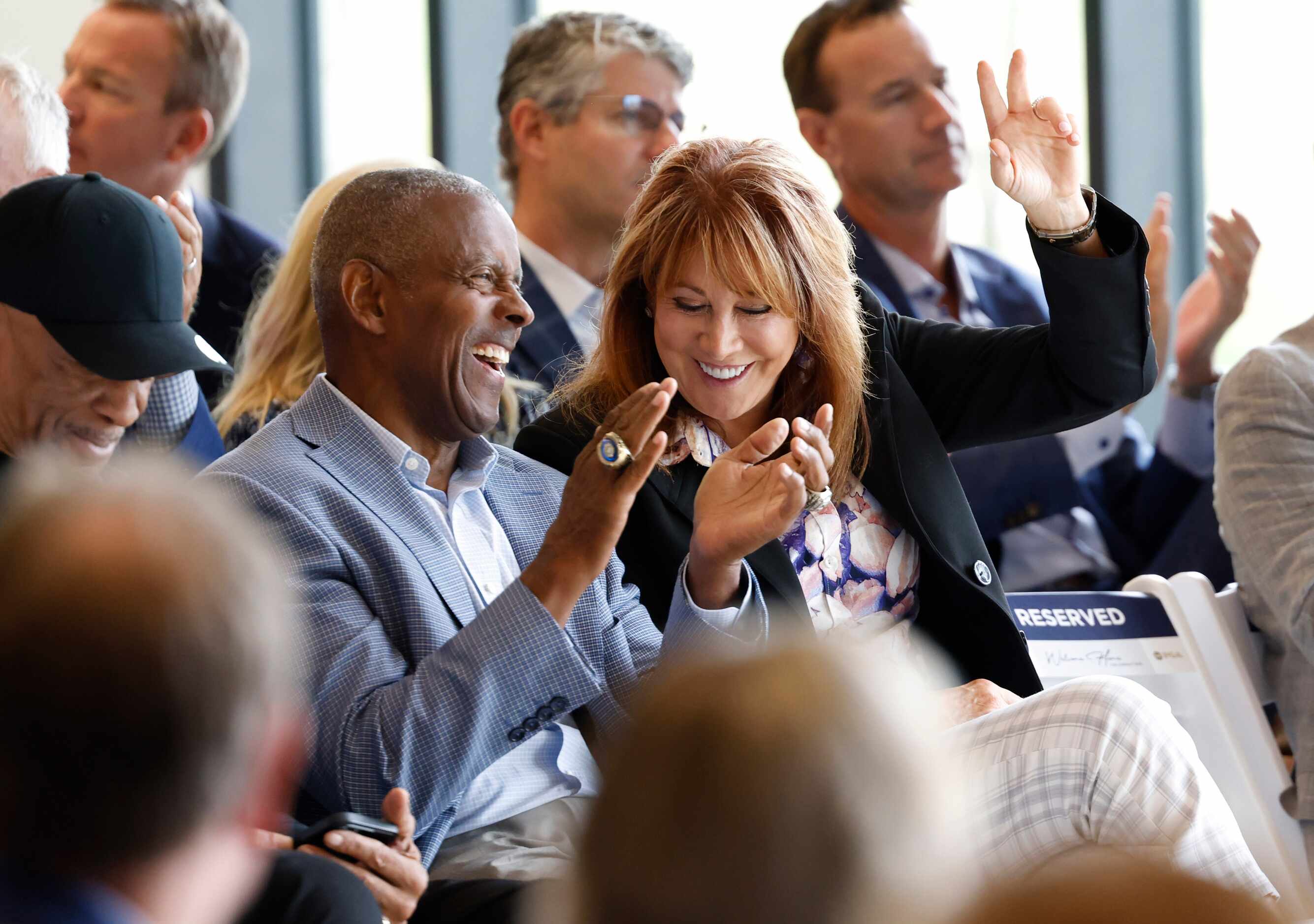 Nancy Lieberman shares a laugh with former Dallas Cowboys player Tony Dorsett during a...
