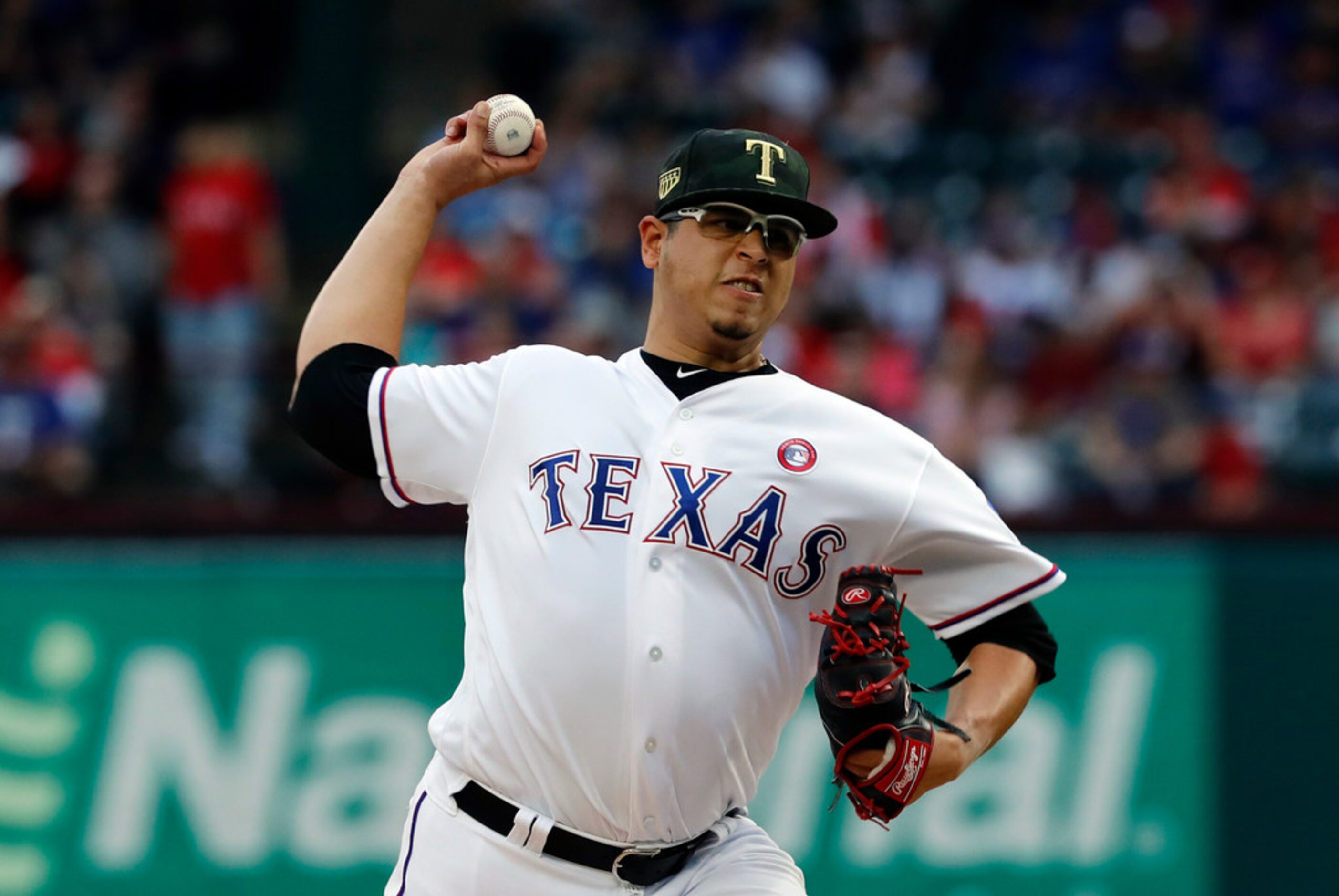 Texas Rangers starting pitcher Ariel Jurado throws to the St. Louis Cardinals in the first...