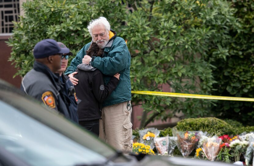 Community members gathered in mourning across the street from the Tree of Life Congregation...