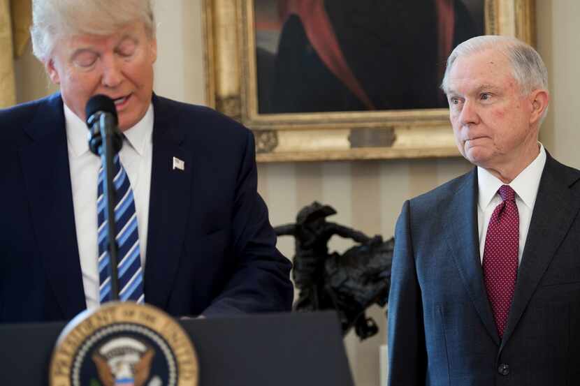 President Donald Trump speaks alongside Jeff Sessions after Sessions was sworn in as...