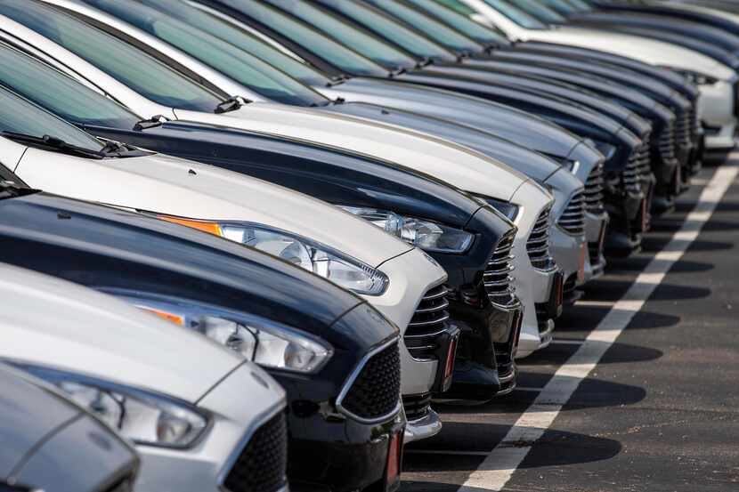 Rows of used cars for sale at a North Texas dealership. Zak Edson, vice president of Lucid...