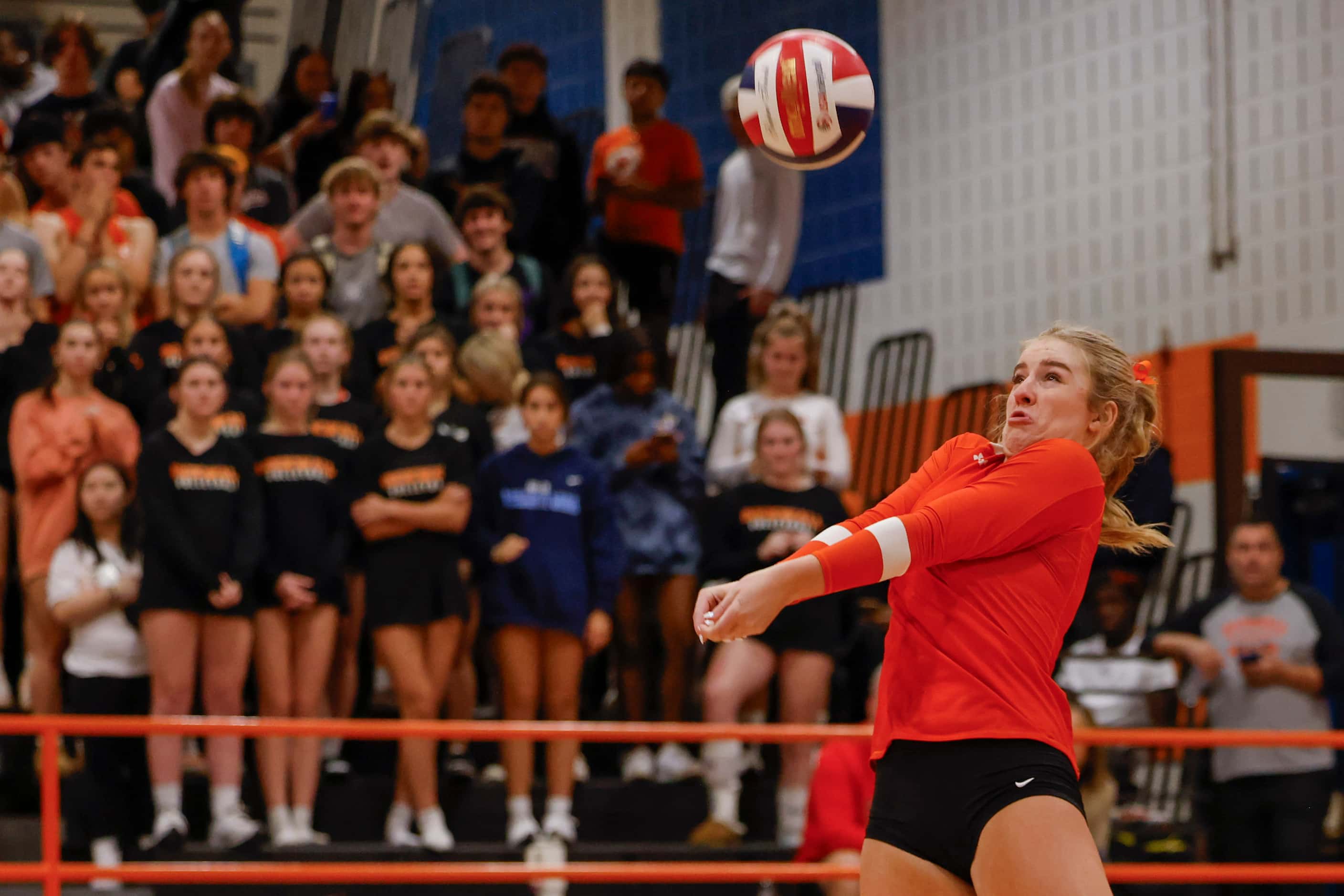 Rockwall high’s Audrey St. Clair digs the ball against Rockwall heath during a volleyball...