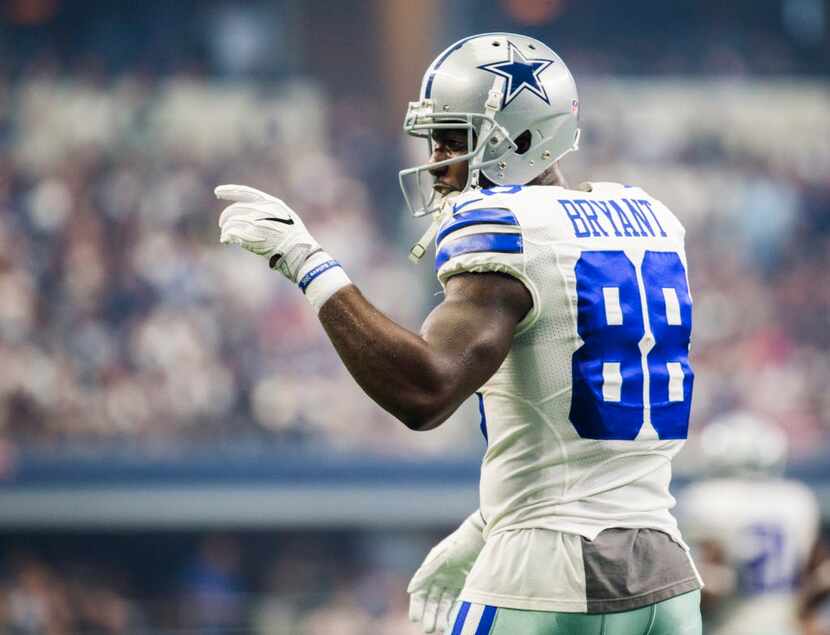 Dallas Cowboys wide receiver Dez Bryant (88) points to the sideline during the first quarter...