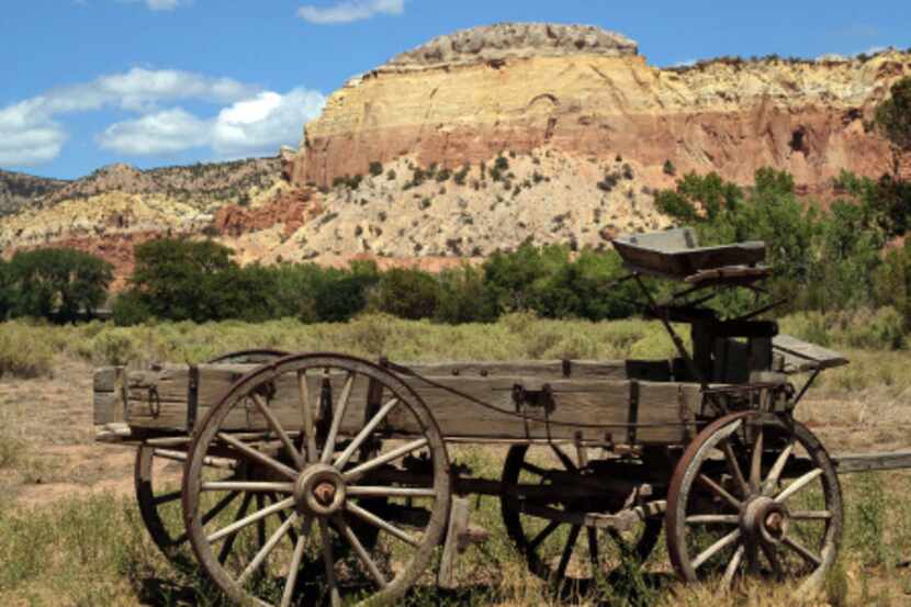 An old wagon greets visitors as they enter the main compound at Ghost Ranch in Abiquiu, New...