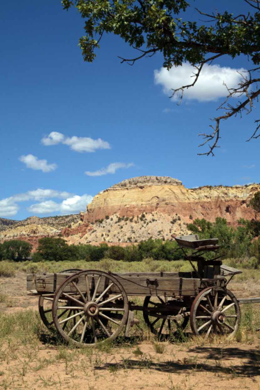 An old wagon greets visitors as they enter the main compound at Ghost Ranch in Abiquiu, New...