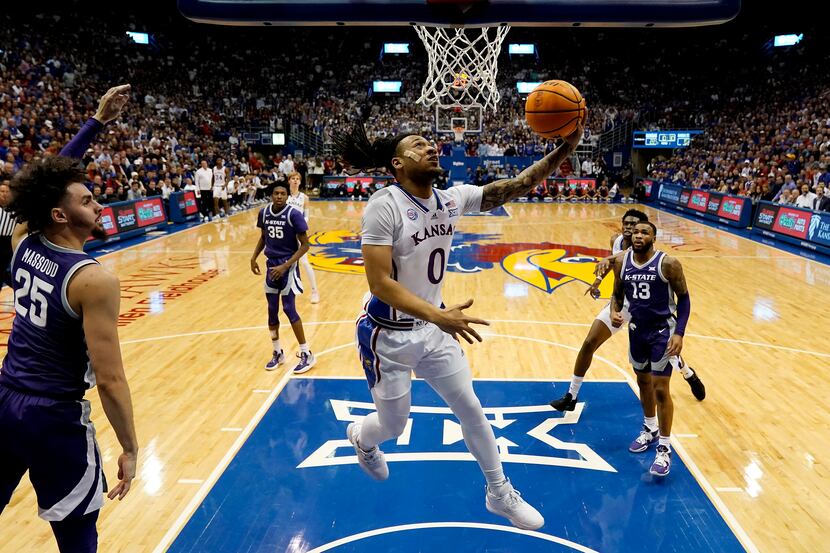 Kansas guard Bobby Pettiford Jr. (0) puts up a shot during the first half of an NCAA college...