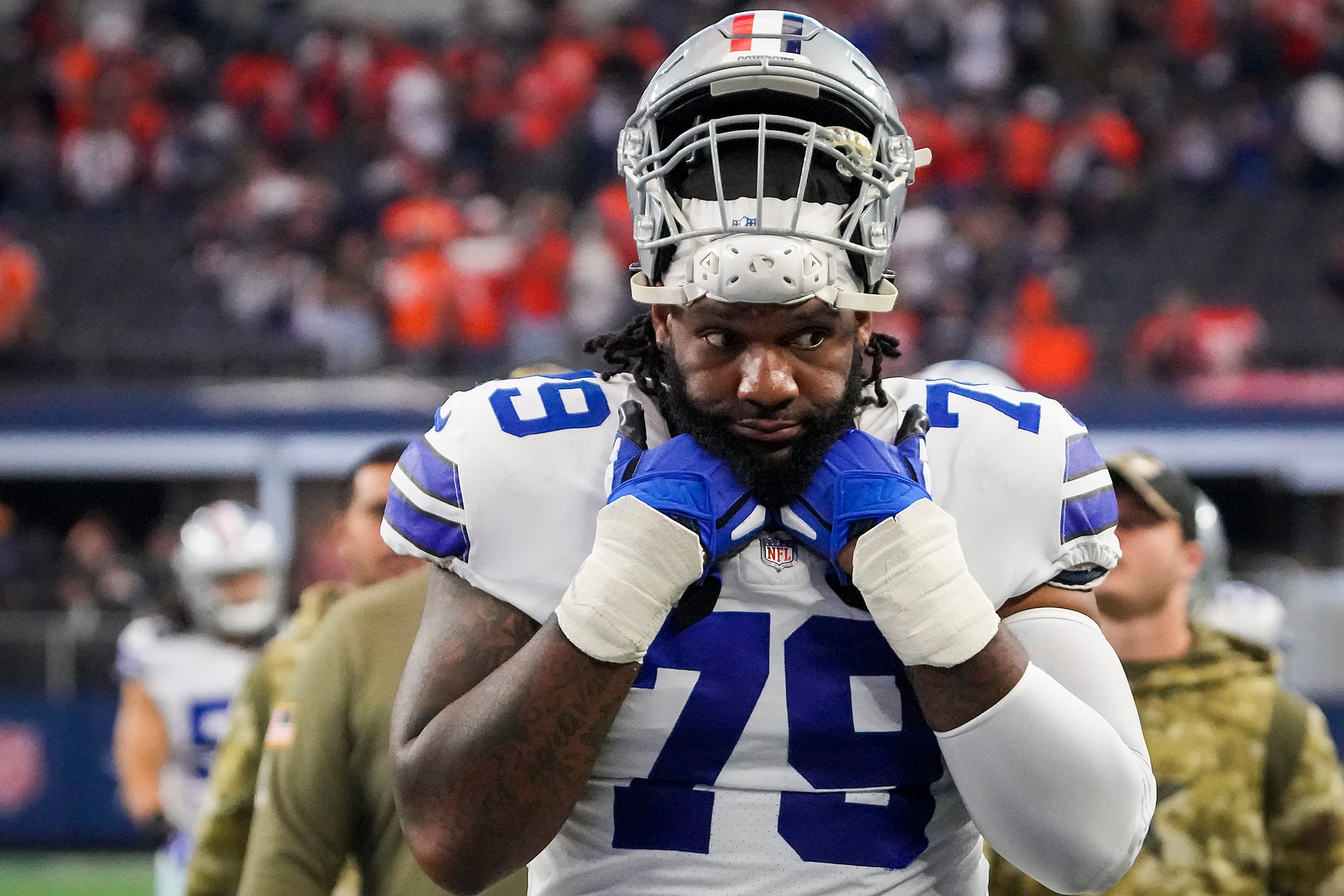 Dallas Cowboys offensive tackle Ty Nsekhe leaves the field after a 30-16 loss to the Denver...