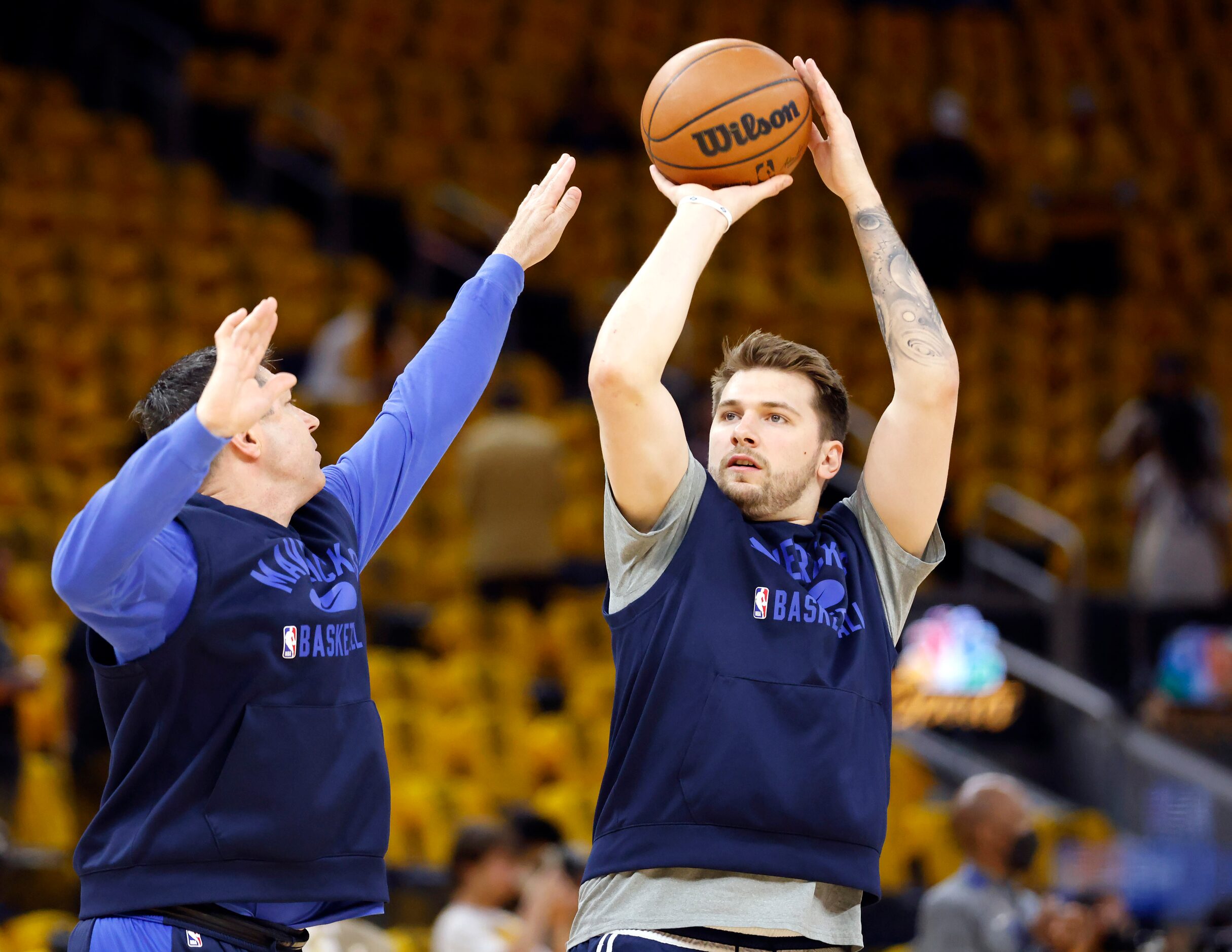 Dallas Mavericks guard Luka Doncic warms up with shooting coach Peter Patton before facing...