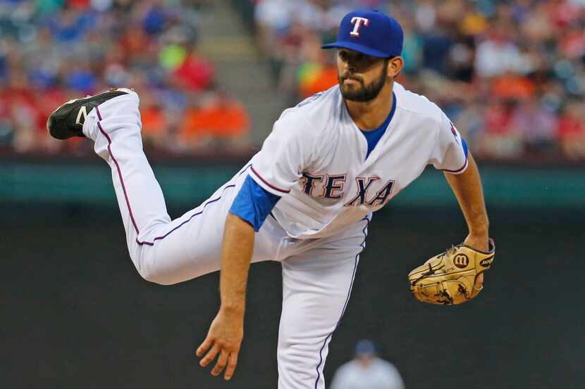 Texas Rangers starting pitcher Nick Martinez (22) throws a third-inning pitch during the...