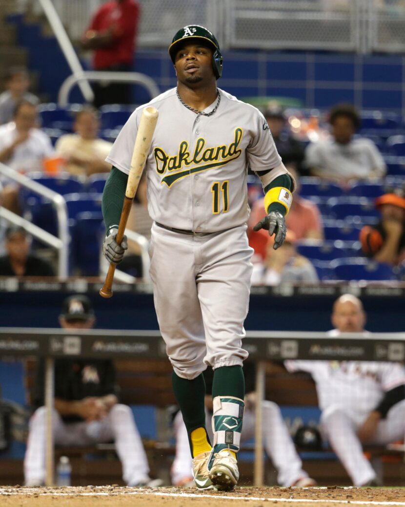 Oakland Athletics' Rajai Davis (11) strikes out during an interleague baseball game against...