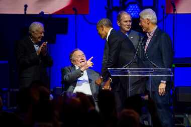 Former presidents Jimmy Carter, George H. W. Bush, Barack Obama, George W. Bush, and Bill...