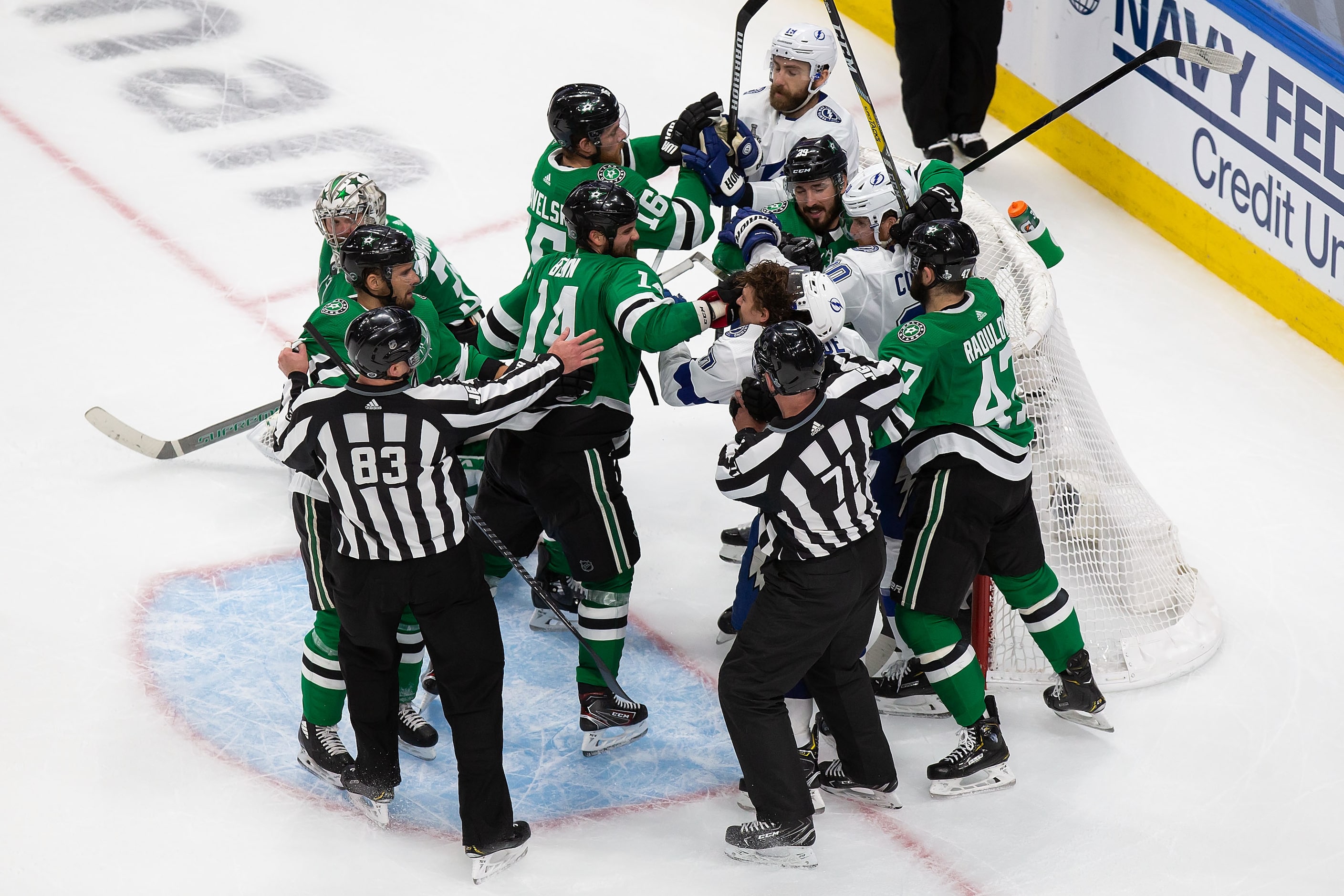 Jamie Benn (14) of the Dallas Stars battles against Yanni Gourde (37) of the Tampa Bay...