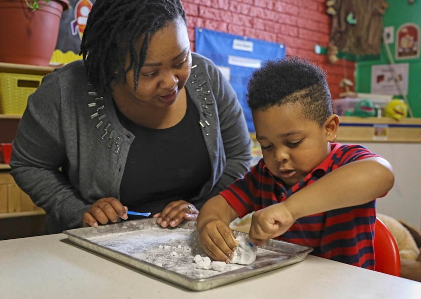 
LaWanda Rather (left), an early learning specialist with Educational First Steps, helps...