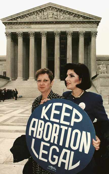 Norma McCorvey (left) with attorney Gloria Allred in front of the U.S. Supreme Court in 1989.