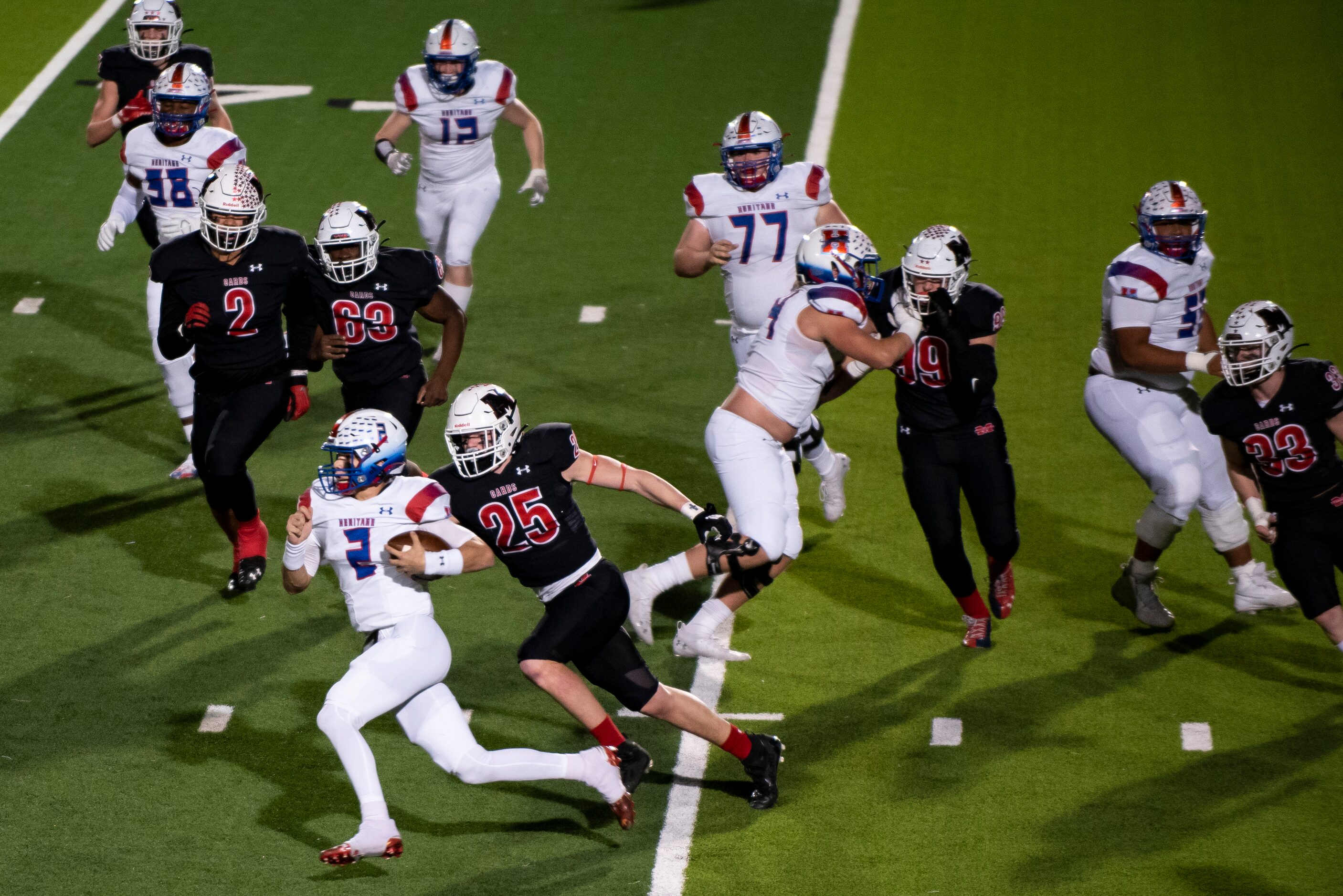 Midlothian Heritage junior Kaden Brown (2) runs up the field for a first down during the...