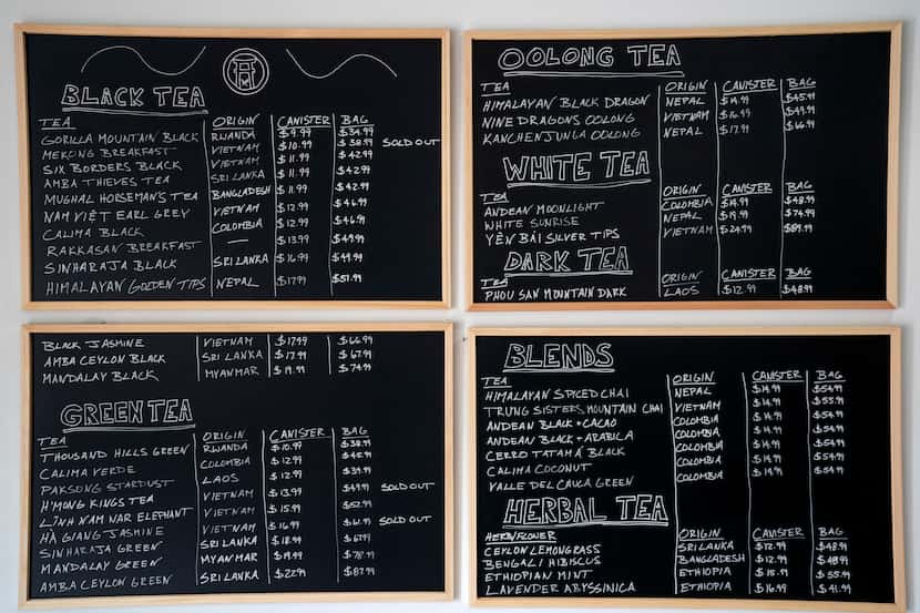 A blackboard menu hangs on the wall of Rakkasan Tea near Hall Street and Ross Avenue in...