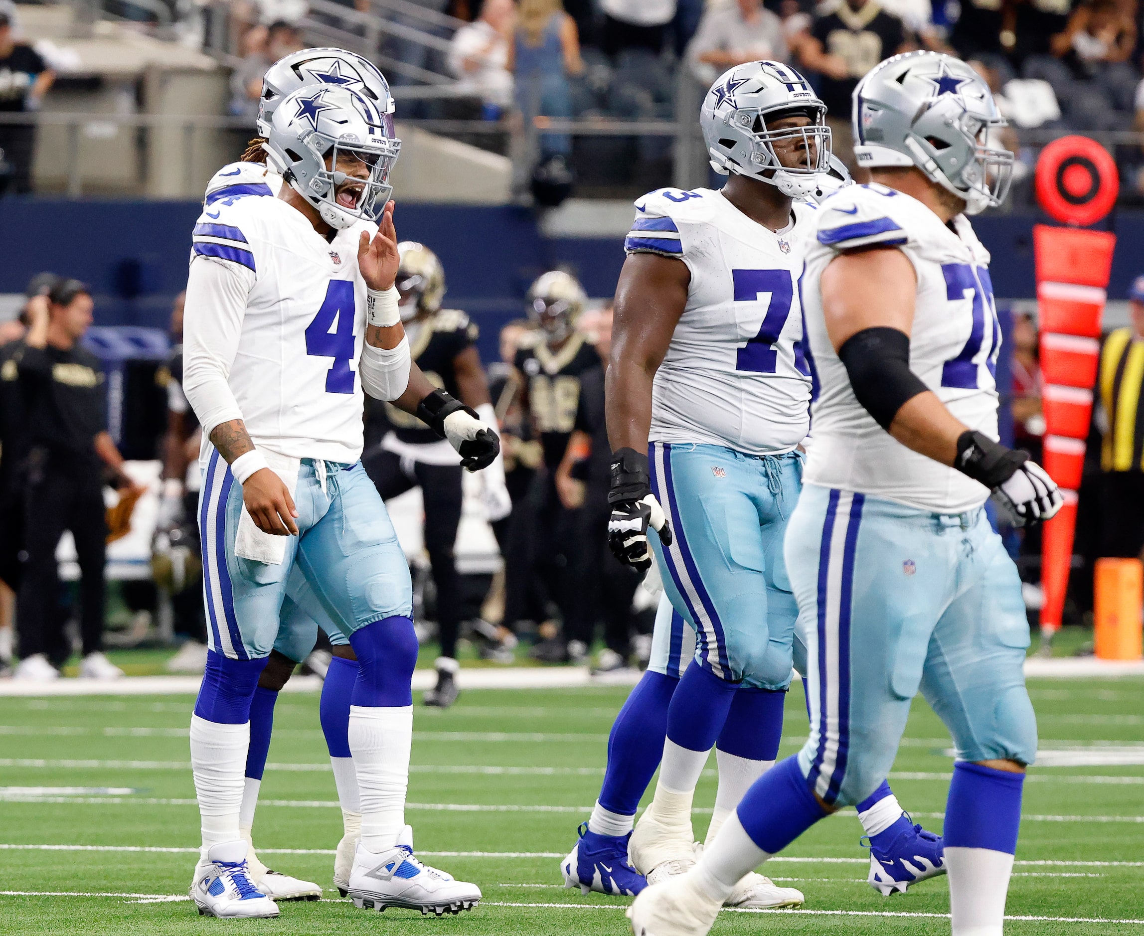 Dallas Cowboys quarterback Dak Prescott (4) reacts after tackling New Orleans Saints...