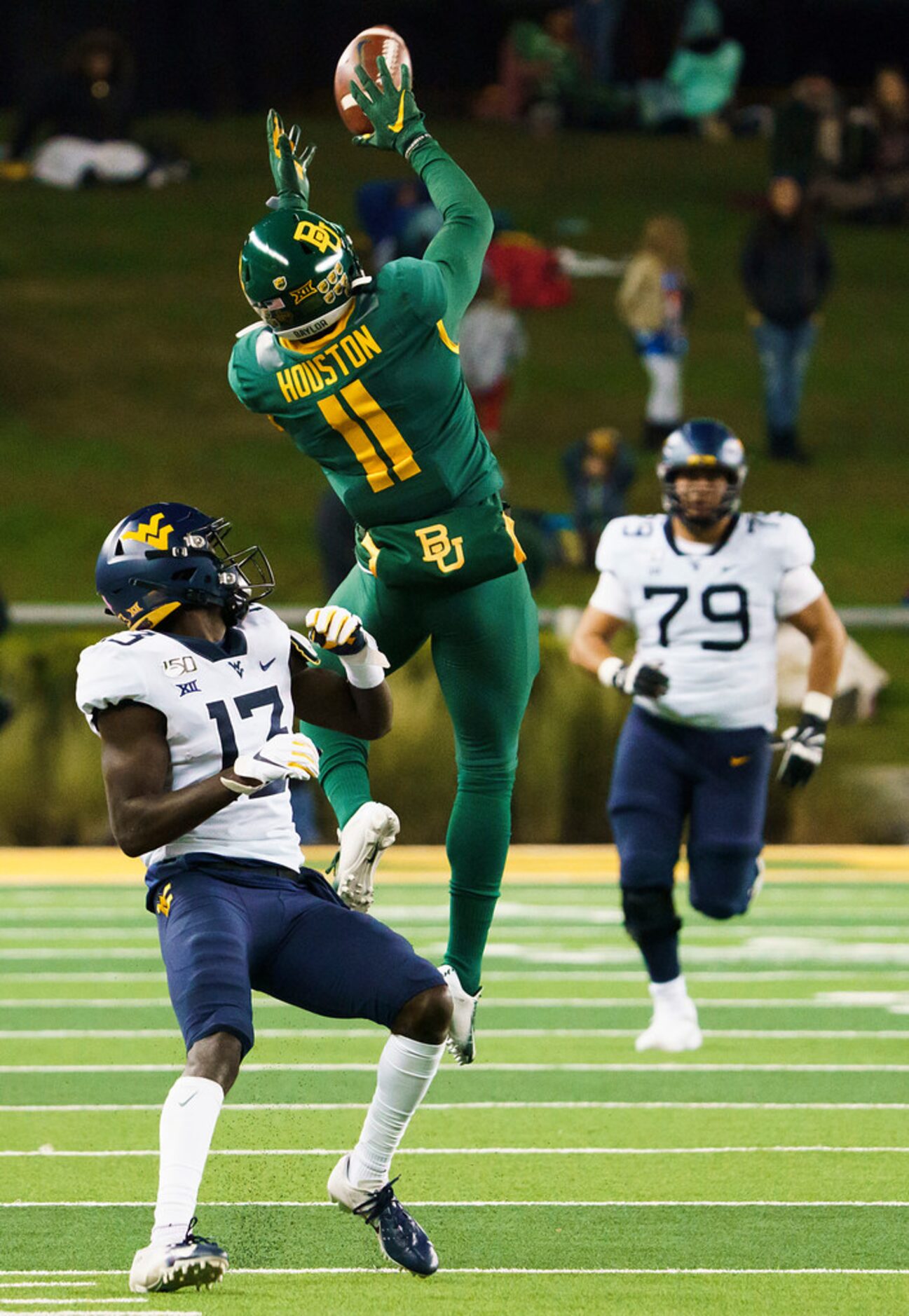 Baylor cornerback Jameson Houston (11) intercepts a pass intended for West Virginia wide...