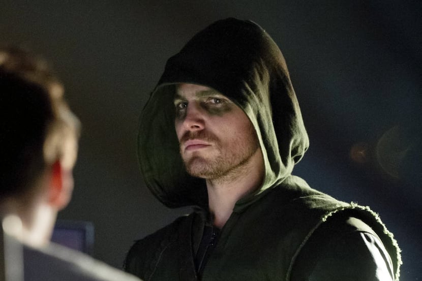 This publicity image released by The CW shows Stephen Amell as Oliver Queen/Arrow in a scene...