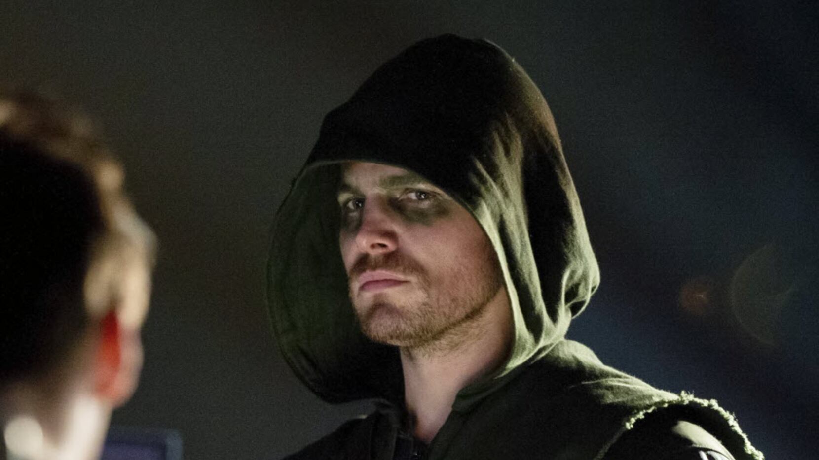 This publicity image released by The CW shows Stephen Amell as Oliver Queen/Arrow in a scene...