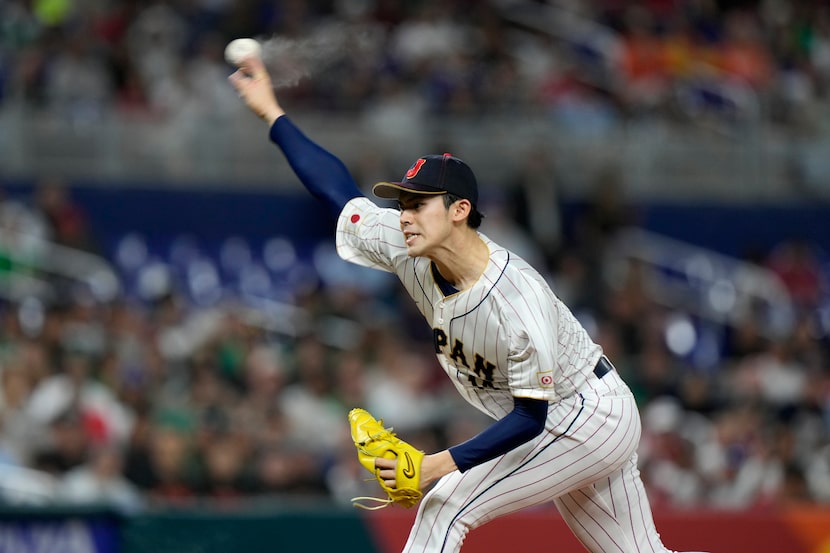 FILE - Japan's Roki Sasaki delivers a pitch during the first inning of a World Baseball...