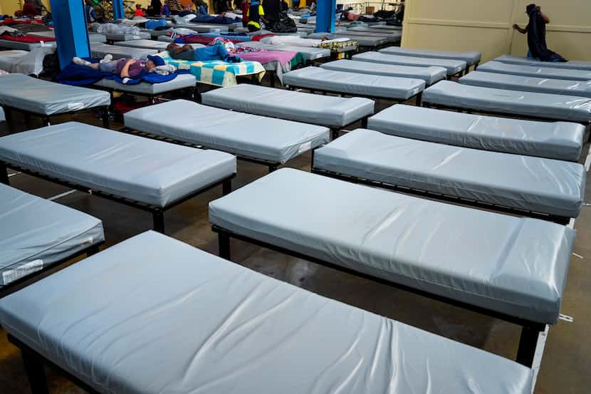 Beds are lined up at Austin Street Center on Wednesday, March 11, 2020, in Dallas.  Shelter...