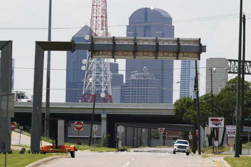 The Dallas skyline emerges over Interstate 30 at Second Avenue in Fair Park on Thursday. A...