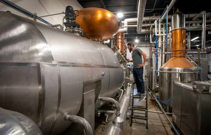 James Williams checks the still at Bendt Distilling Co. on Nov. 13, 2019 in Lewisville, Texas.