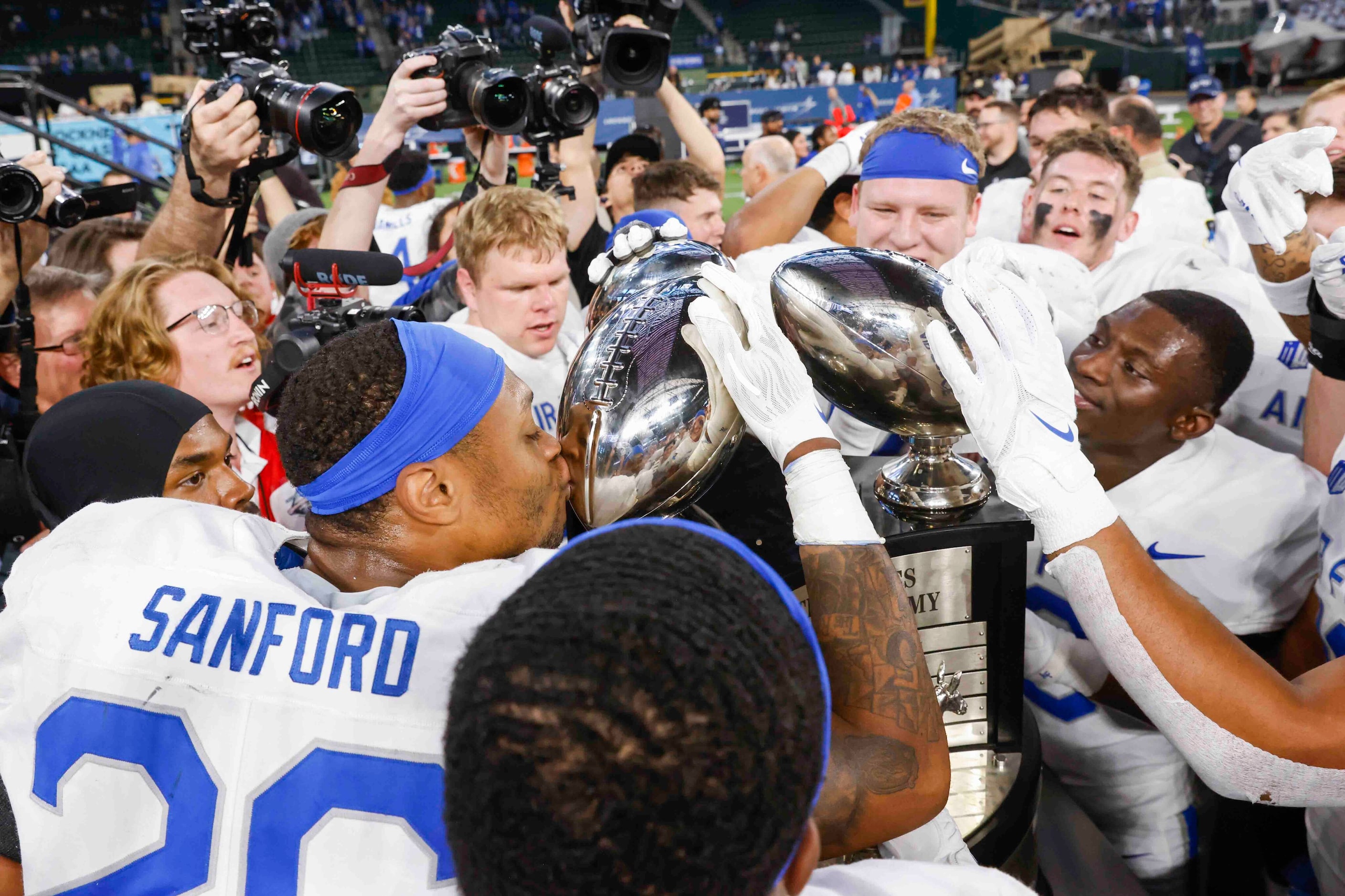 Air Force players celebrate their win against Army during an NCAA football game at Globe...