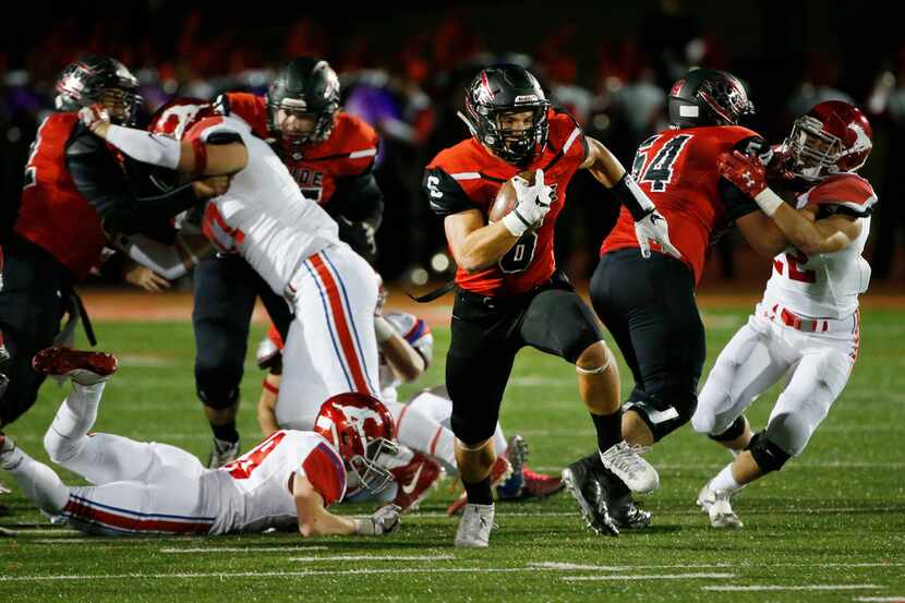 Colleyville Heritage running back Caleb Murphy breaks past the Grapevine defense for a...
