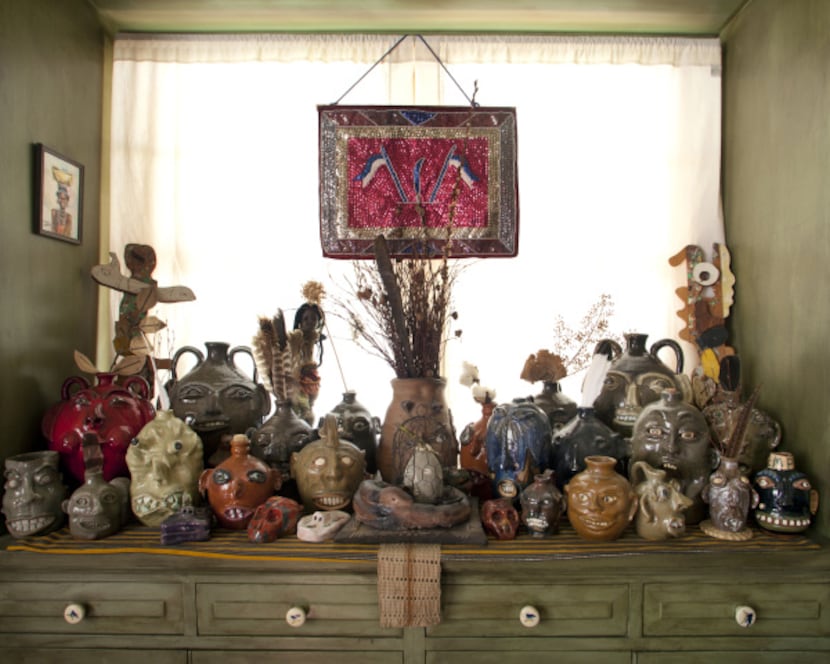 Face jugs collection in the dining room at the home of artist Jean Lacy photographed in...