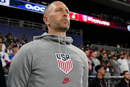 FILE - United States head coach Gregg Berhalter looks onto the pitch before an international...