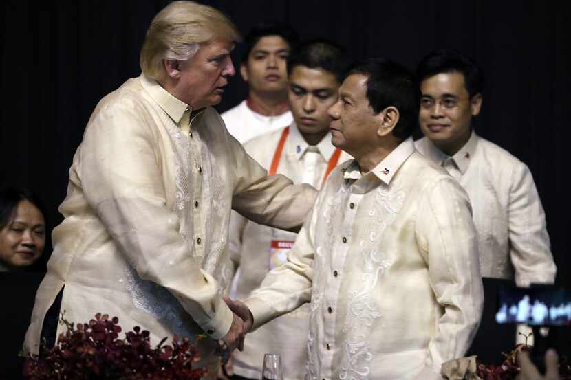 President Donald Trump shook hands with Philippines President Rodrigo Duterte at an ASEAN...